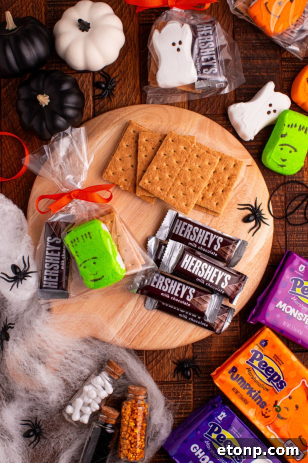 Spooky Smores Treat Packs 7 Halloween Smores Gift Bag on table with chocolate bars and graham crackers to the side