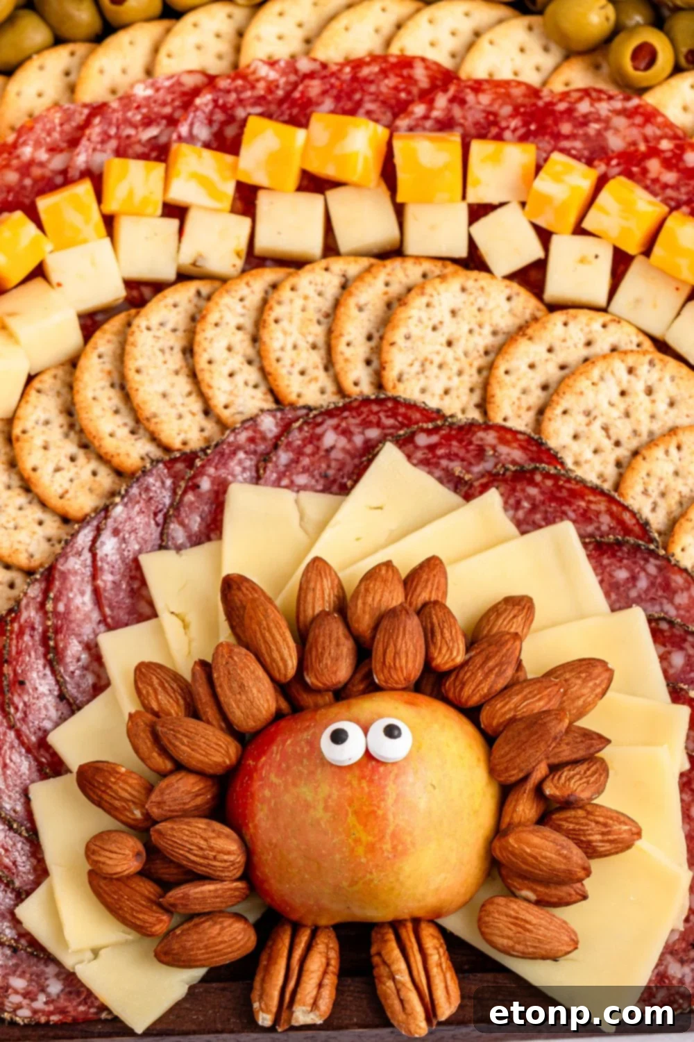Turkish Mezze Spread 12 Thanksgiving snack board shaped like a turkey, placed at an inviting angle on a festive table setting.