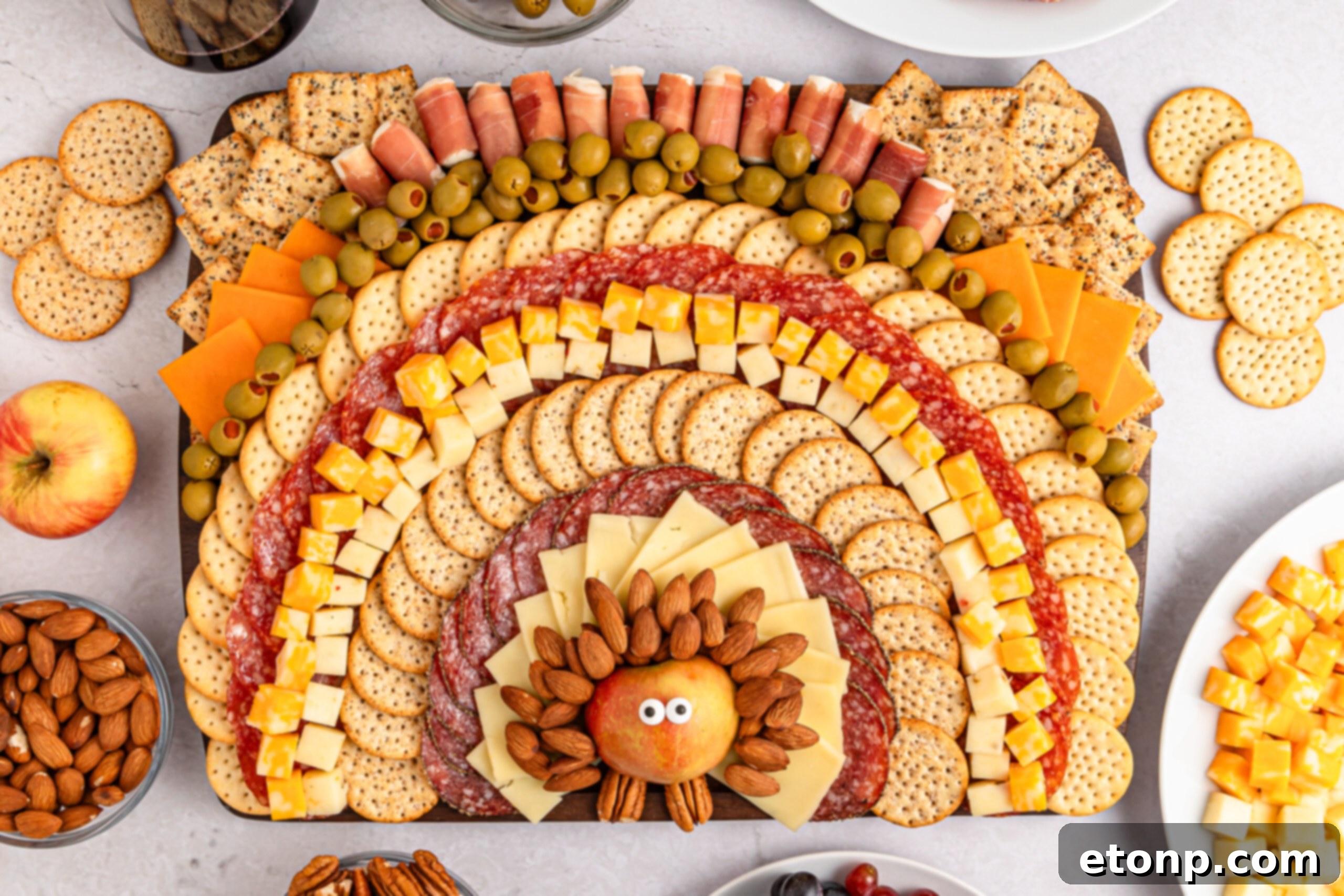 Turkish Mezze Spread 17 A grand Turkey Snack Board, fully assembled with various meats, cheeses, crackers, and garnishes, forming the shape of a festive turkey with its detailed feathers.