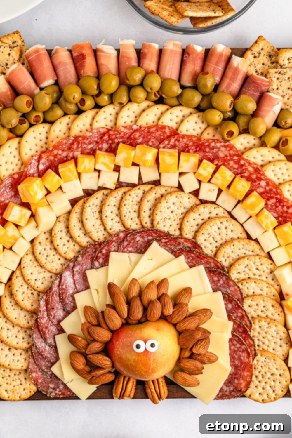 Turkish Mezze Spread 3 Close-up overhead shot of the Turkey Snack Board featuring an array of deli meats, cheeses, and crackers intricately arranged to form the turkey's 'feathers'.