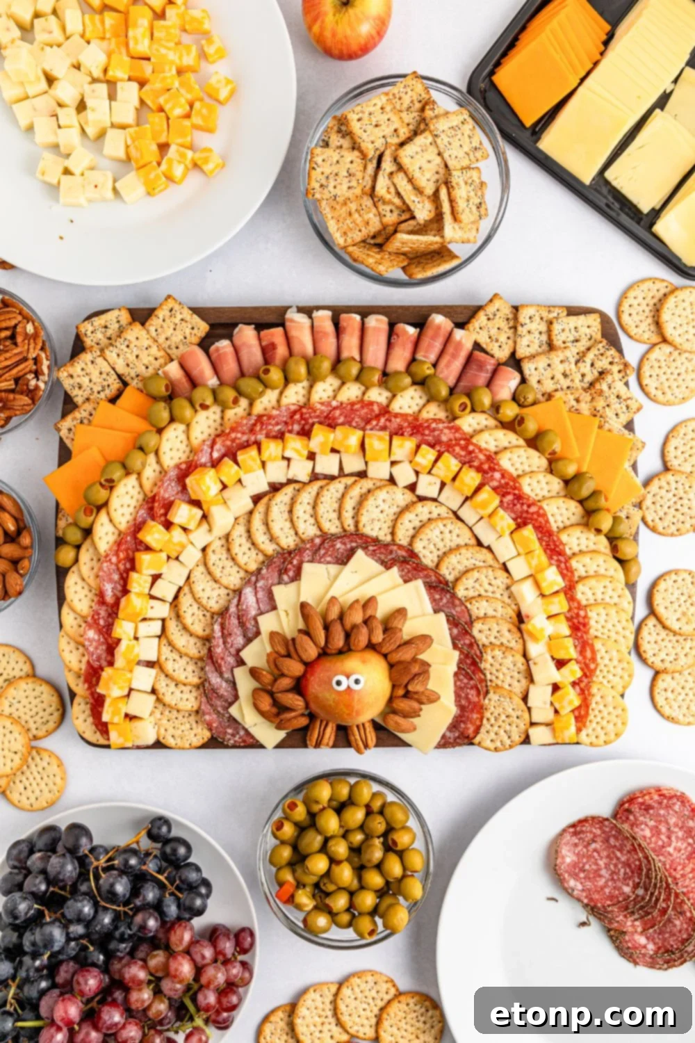 Turkish Mezze Spread 4 Full table shot with the Turkey Snack Board as the focal point, surrounded by extra bowls of olives, grapes, and other snacks, indicating a bountiful spread.
