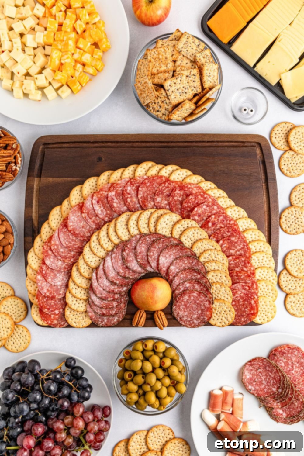 Turkish Mezze Spread 7 Meat and crackers spread out on a tray, demonstrating the layout for creating the Turkey Snack Board's feather pattern.