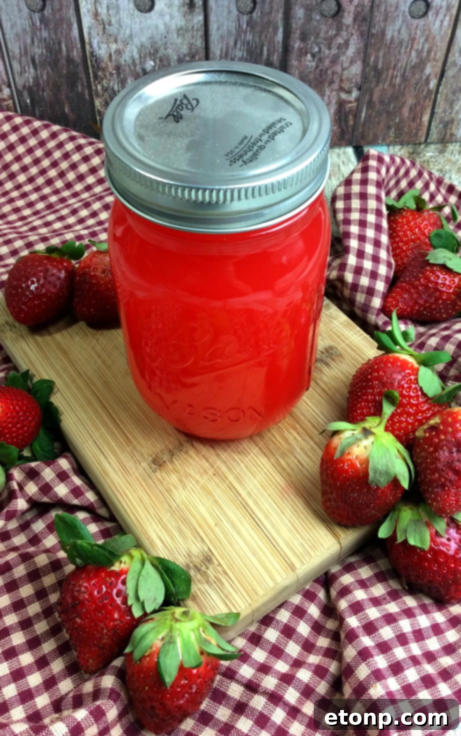Ingredients for strawberry moonshine laid out on a table