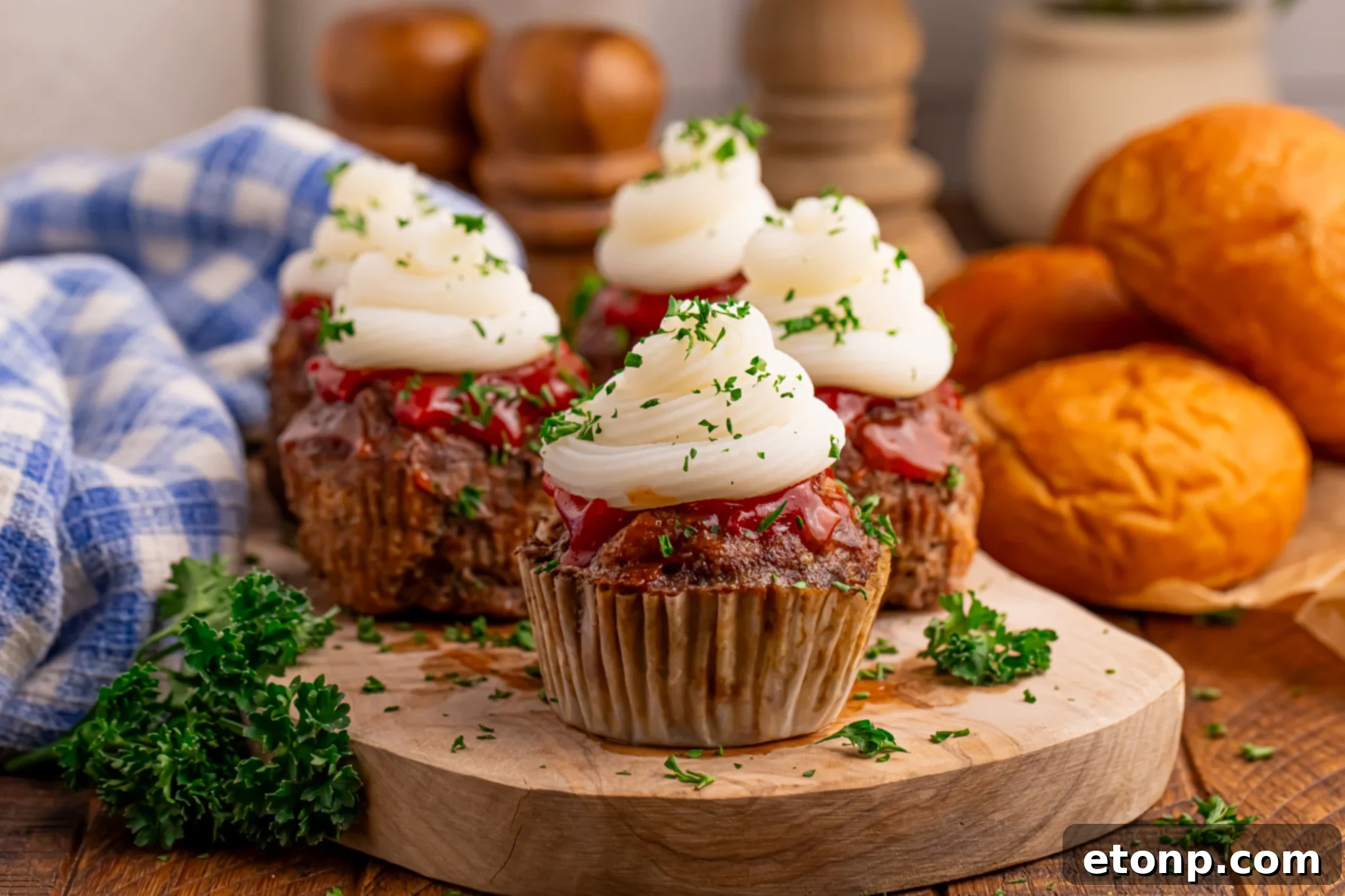 Meatloaf Cupcakes sitting on a tray to show the layers to the meat cupcake