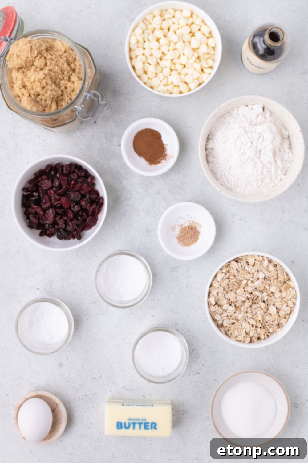 ingredients for cranberry oatmeal cookies on table in single serve bowls 