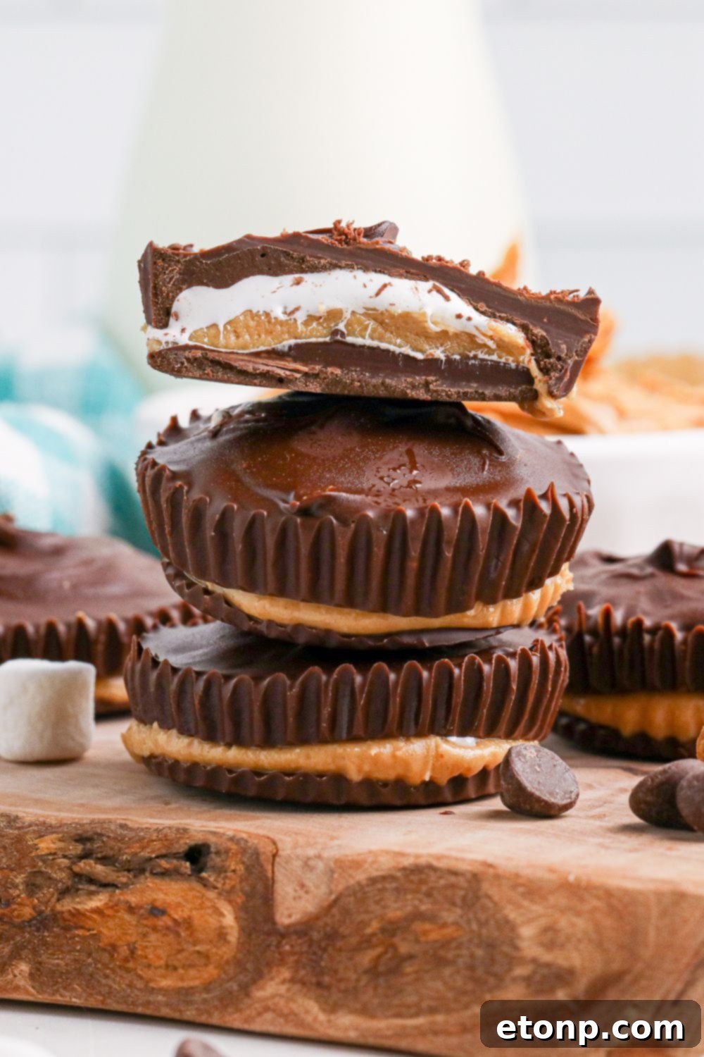 Peanut Butter Marshmallow Cups on table stacked on top of each other 