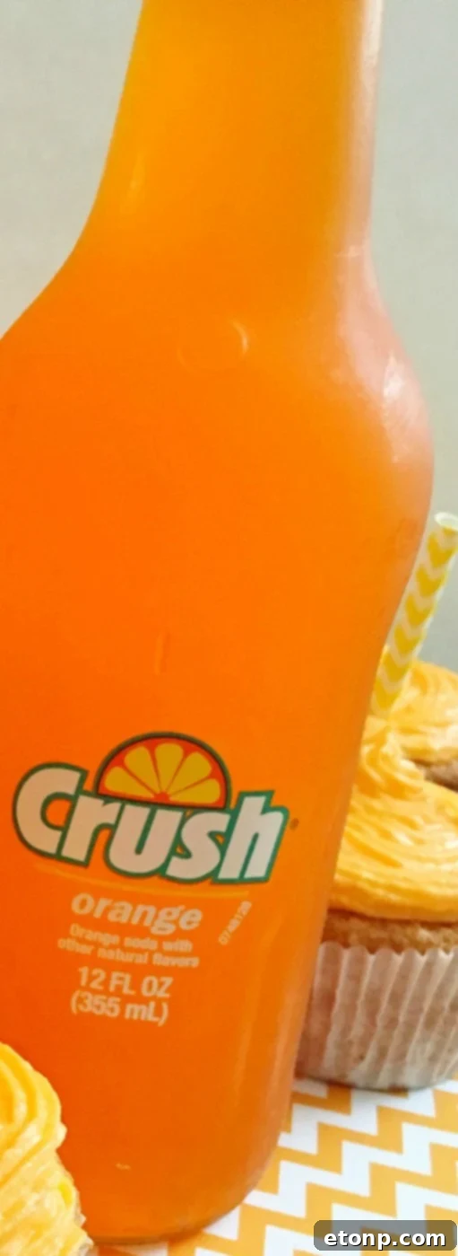 Close-up of the vibrant Orange Creamsicle Cocktail with a creamy top layer, ready to be enjoyed.