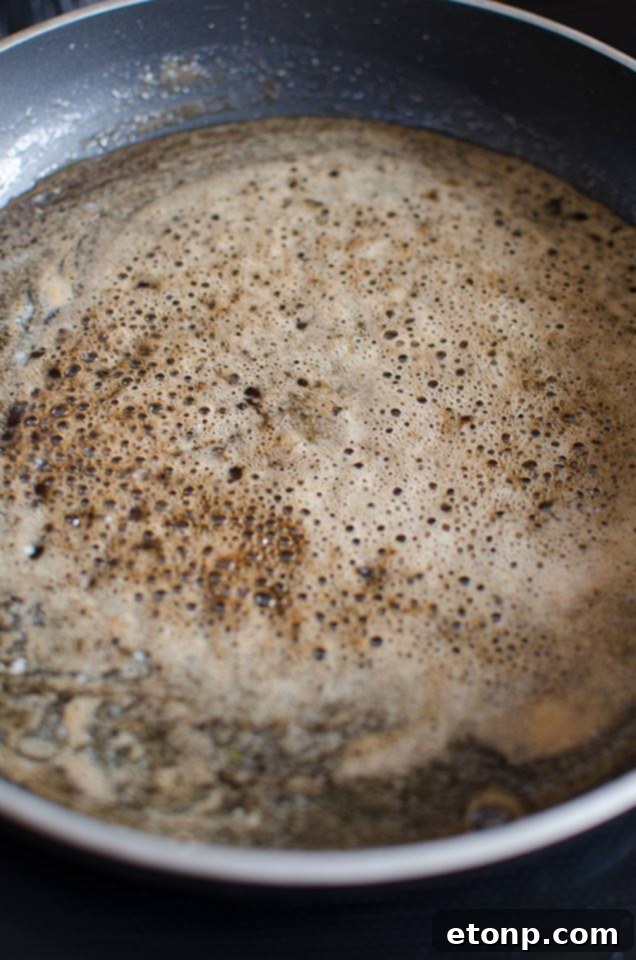 Bottle of Coca-Cola next to a bowl of brown sugar