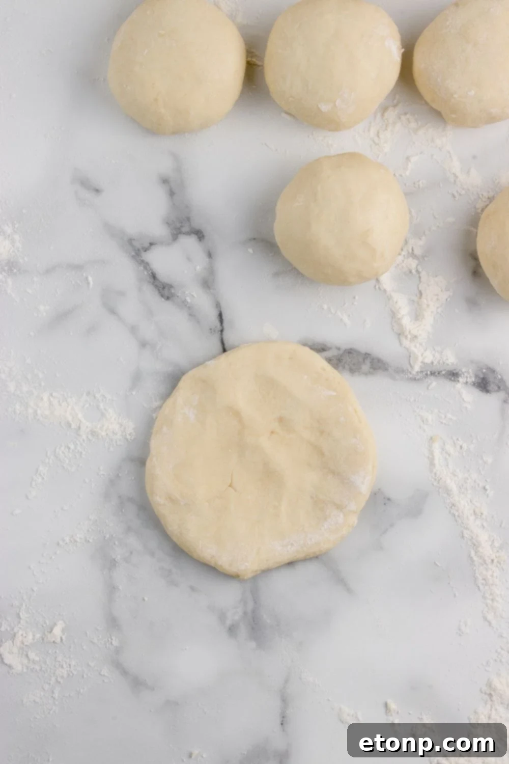 round dough for making rolls on table 