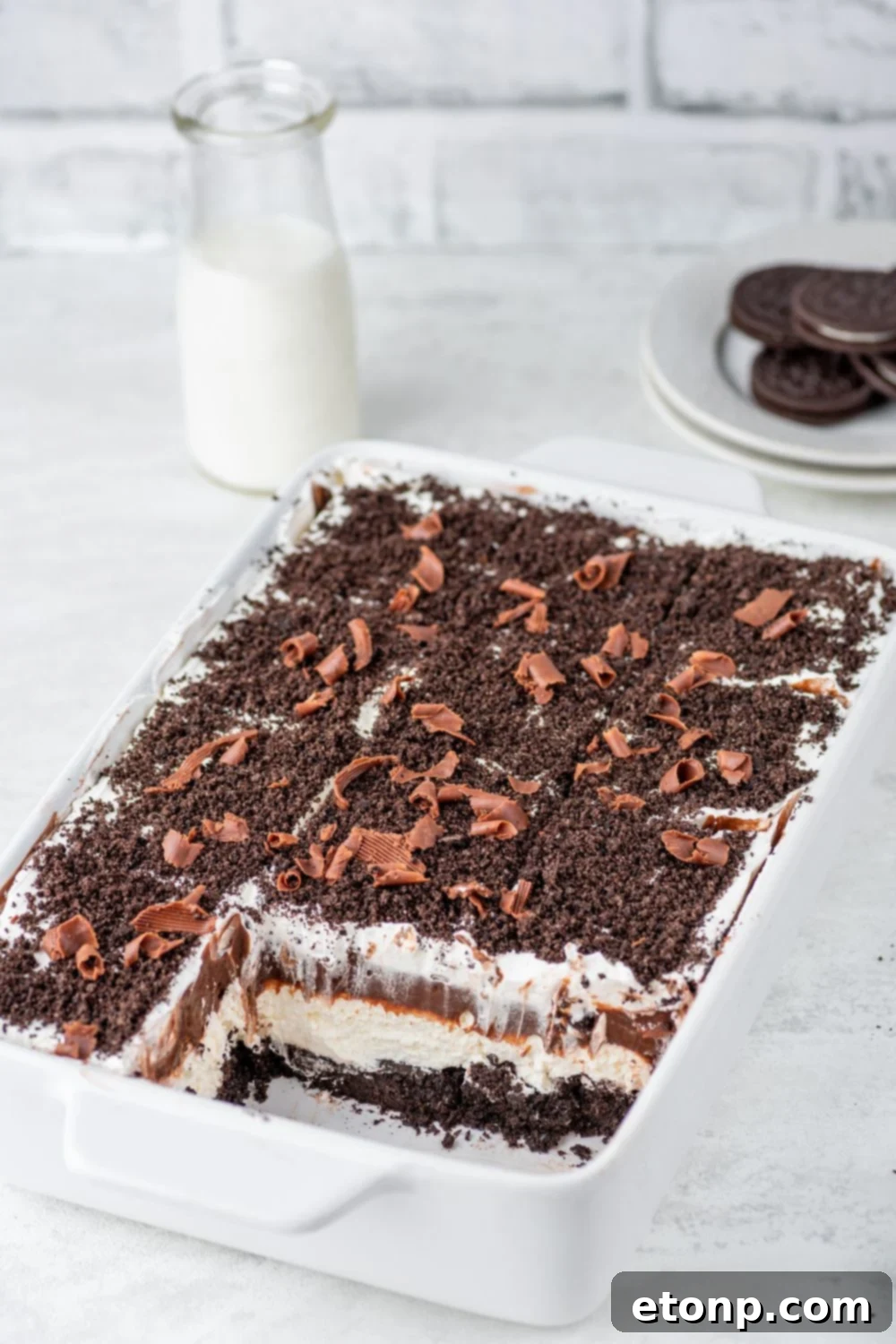 Decadent Chocolate Oreo Dream 12 Chocolate Oreo Lush in pan with a few slices taken out of it