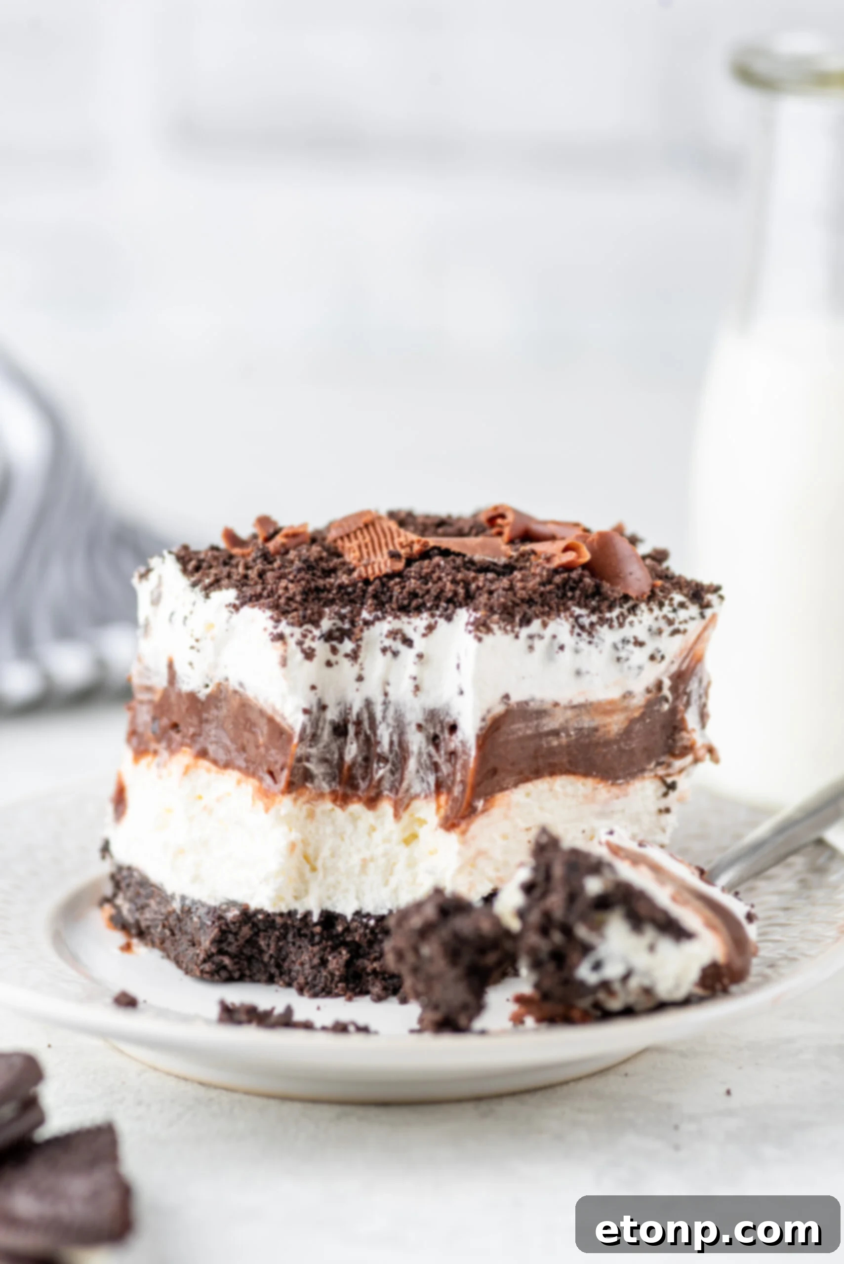 Decadent Chocolate Oreo Dream 18 Chocolate Oreo Lush placed on plate with a bite taken out of it