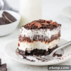 Decadent Chocolate Oreo Dream 19 Chocolate Oreo Lush placed on plate with a bite taken out of it