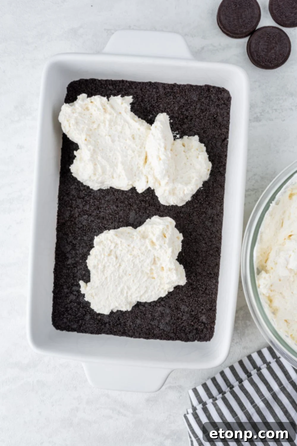 Decadent Chocolate Oreo Dream 7 cheesecake layer spread on top of cookie crust