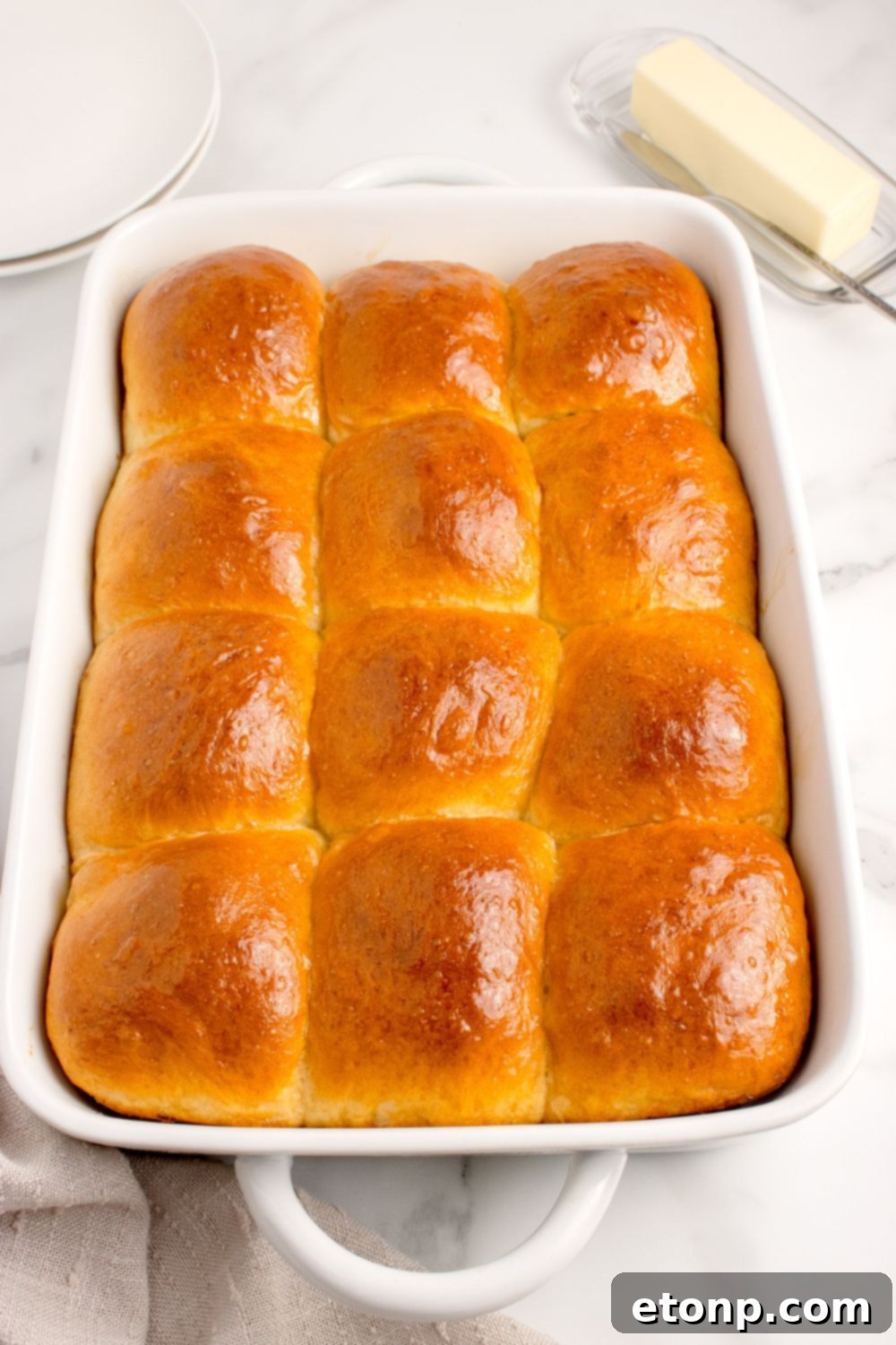 Pull Apart Dinner Rolls arranged neatly in a baking dish on a kitchen counter