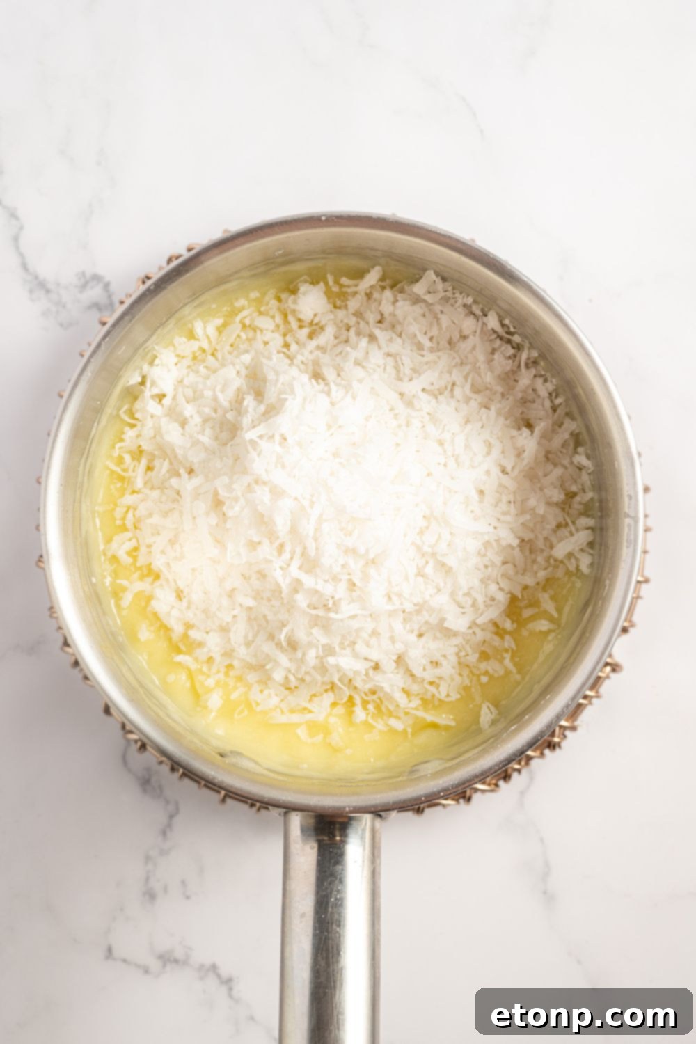 filling for a Coconut Meringue Pie in a saucepan