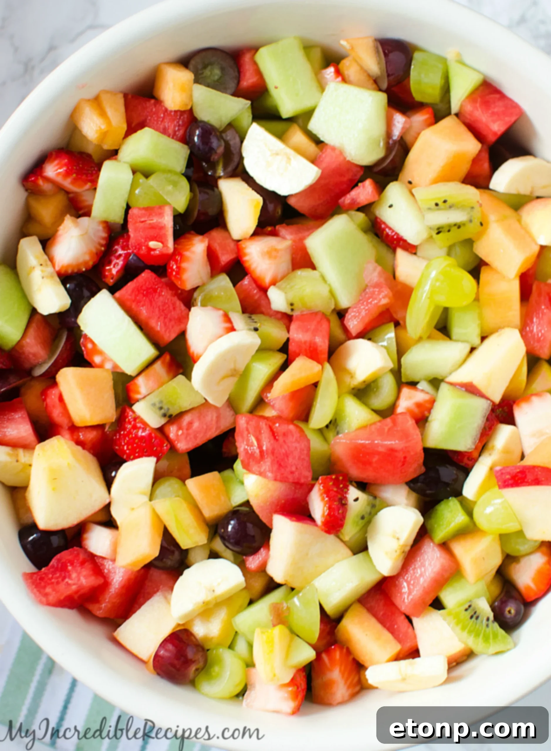 Vibrant Strawberry Kiwi Melon Fruit Salad in a large serving bowl, perfect for summer gatherings