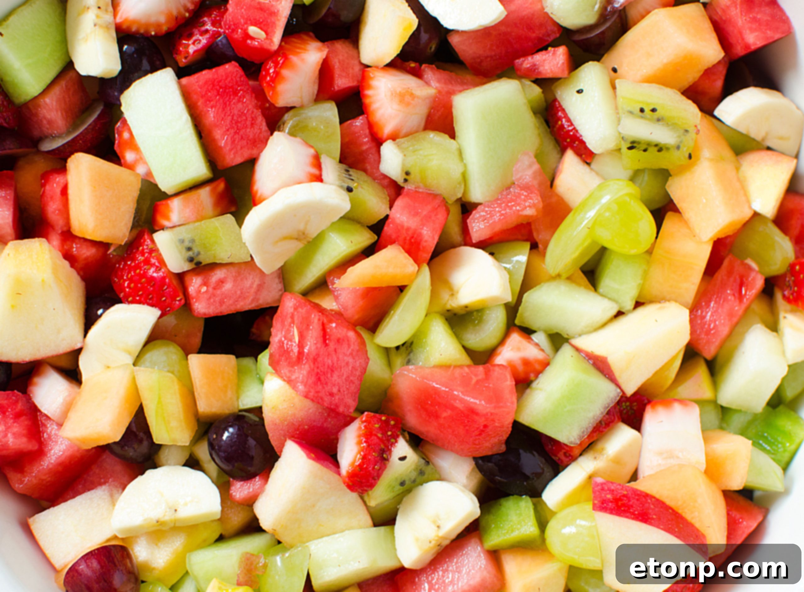Happy guests enjoying the fruit salad at a summer get-together