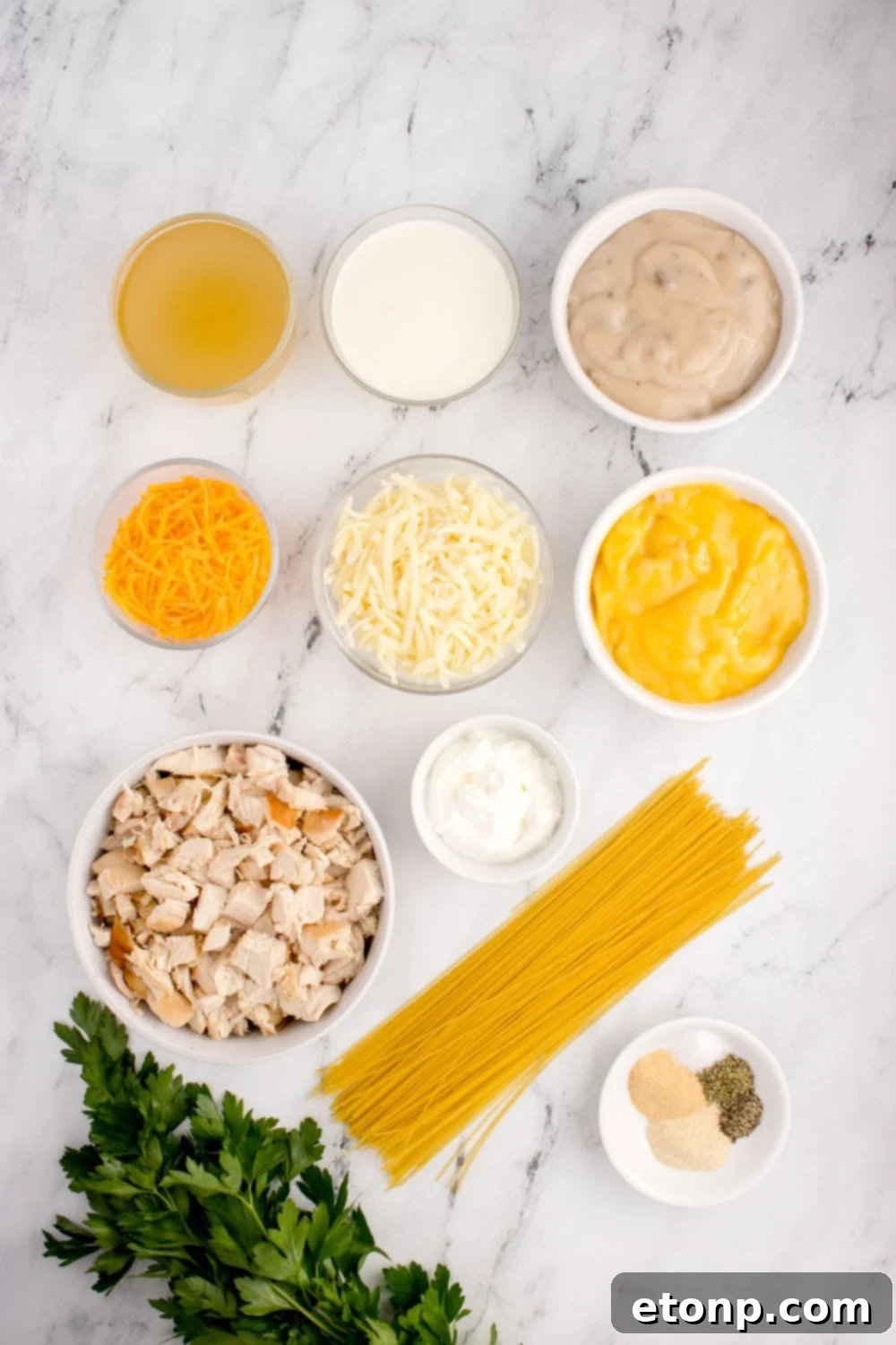 ingredients for chicken tetrazzini in single serve bowls on table 