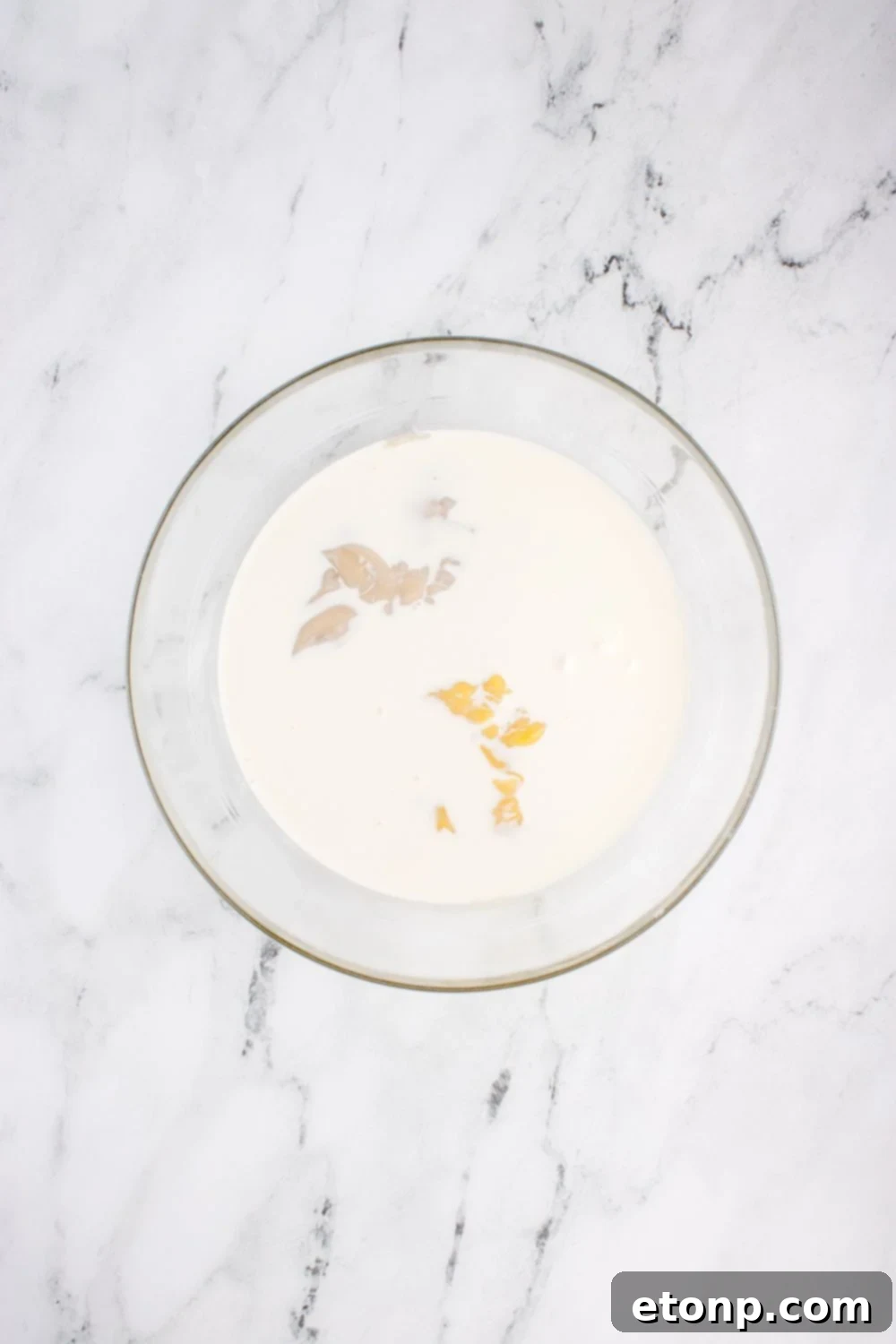 bowl with cream sauce ingredients in it for chicken tetrazzini