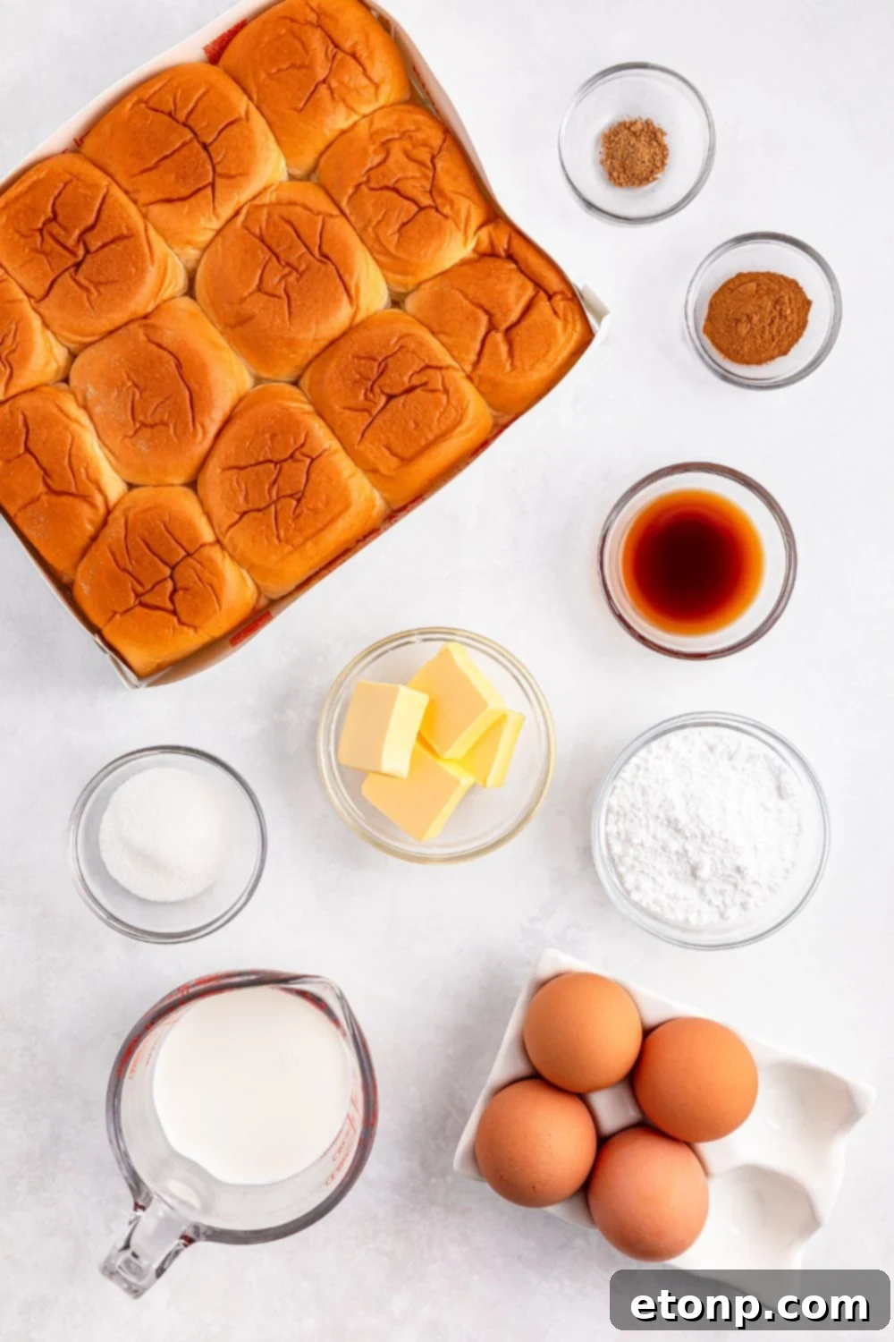 all the simple ingredients for Hawaiian Roll French Toast neatly arranged on a white table