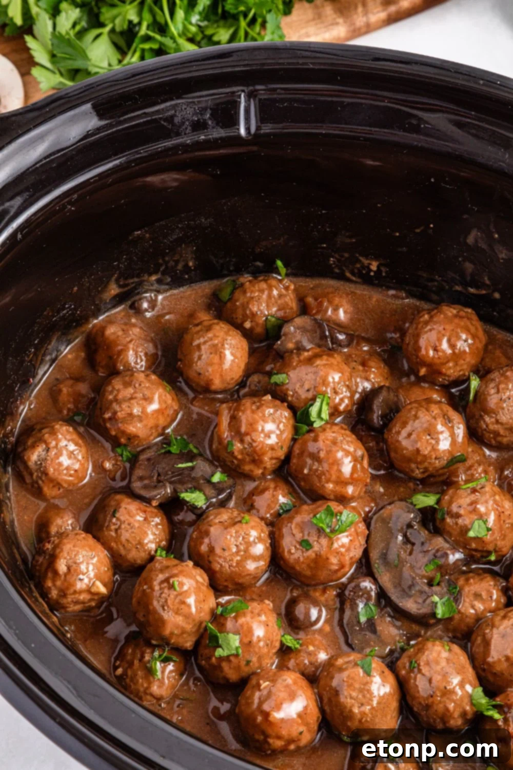 Comforting Slow Cooker Salisbury Steak Meatballs 16 Crock Pot Salisbury Steak Meatballs in a slow cooker sitting on a table