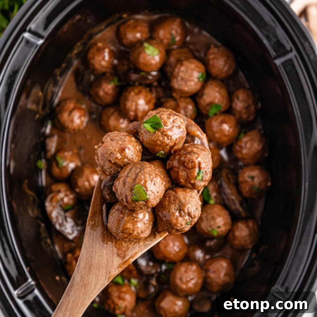 Comforting Slow Cooker Salisbury Steak Meatballs 3 Crock Pot Salisbury Steak Meatballs in crock pot with a spoon with a few meatballs in it above crock pot