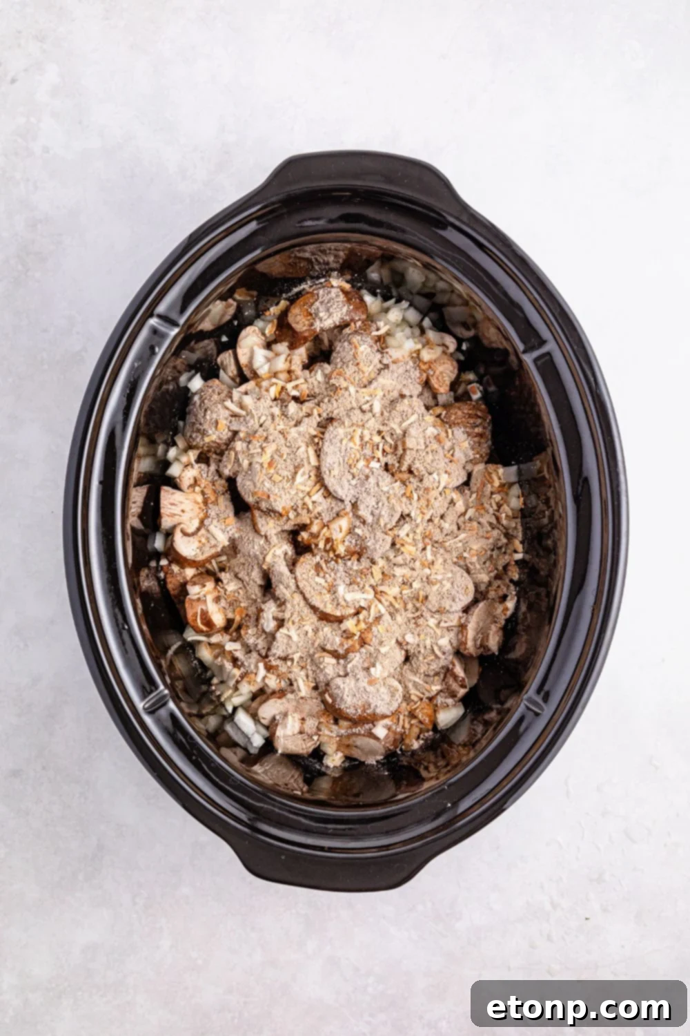 Comforting Slow Cooker Salisbury Steak Meatballs 10 ingredients for this Crock Pot Salisbury Steak Meatballs recipe in a crockpot on table