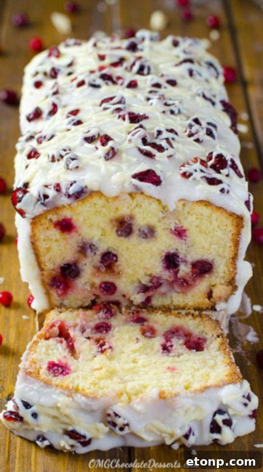 Cranberry pound cake with a sweet glaze and fresh cranberries