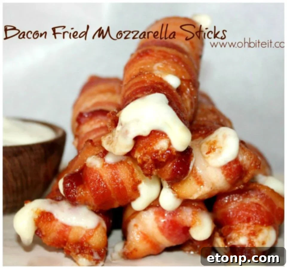 Crispy bacon-wrapped fried mozzarella sticks arranged on a plate