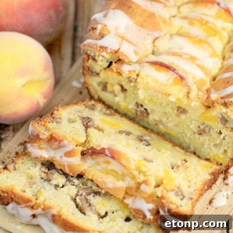 Slice of pecan and peach quick bread on a serving plate