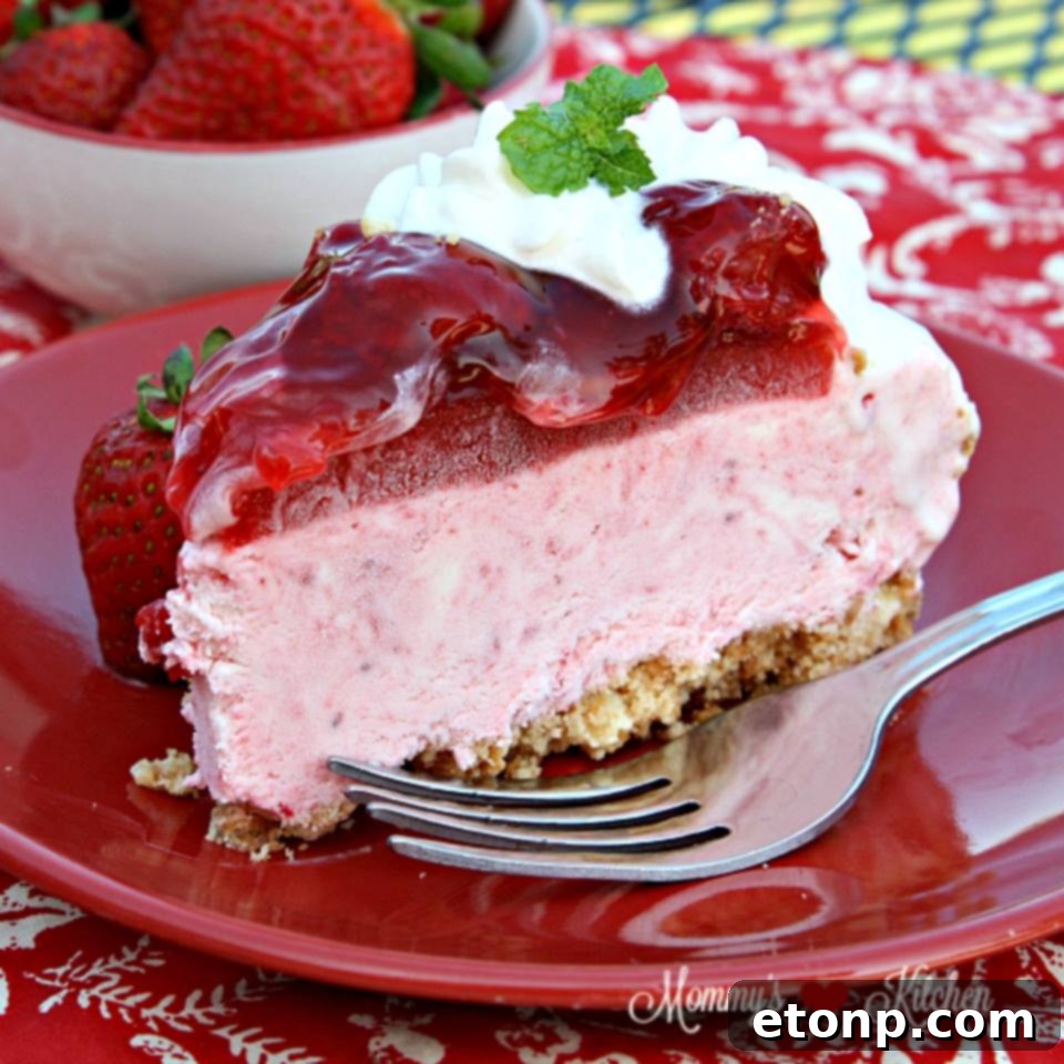 No-bake strawberry ice cream cake topped with fresh strawberries