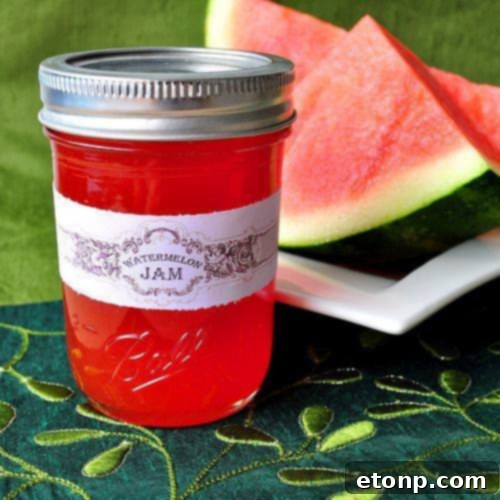 Jar of homemade watermelon jam with fresh watermelon slices