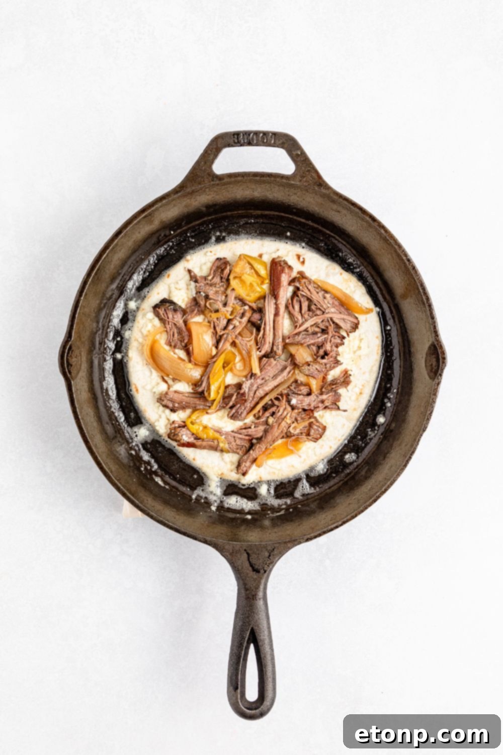 The Mississippi Pot Roast Remix 12 Mississippi Pot Roast Quesadilla being assembled in pan