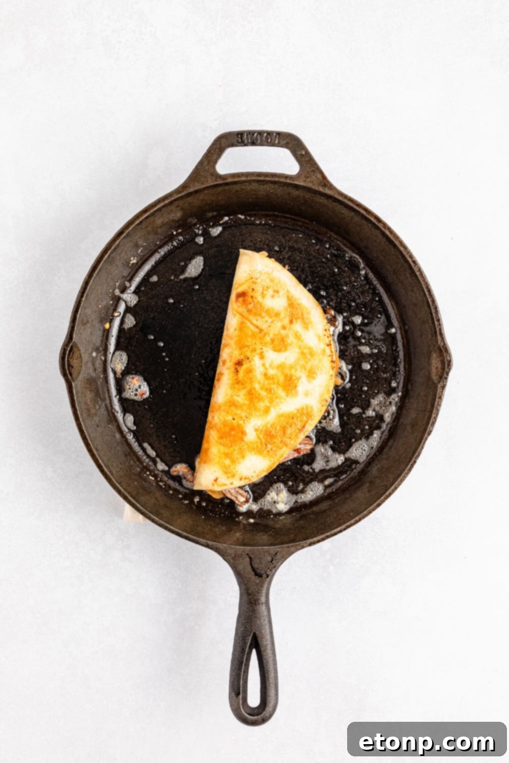 The Mississippi Pot Roast Remix 13 skillet with a Mississippi Pot Roast Quesadilla in it