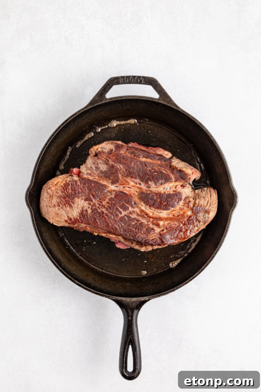 The Mississippi Pot Roast Remix 10 pot roast being seared in a skillet
