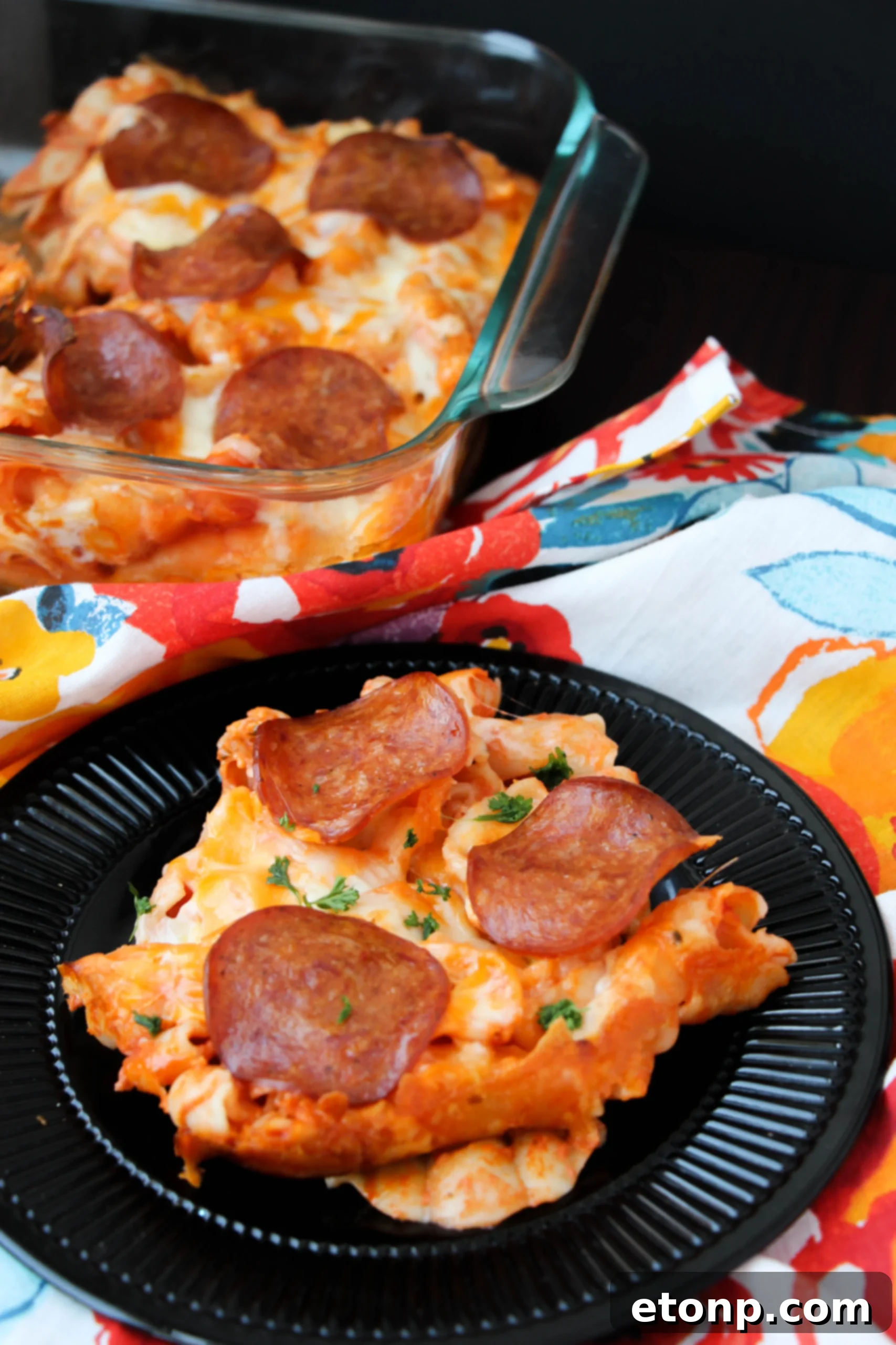 Close-up of the pepperoni pizza pasta bake in a casserole dish before baking.