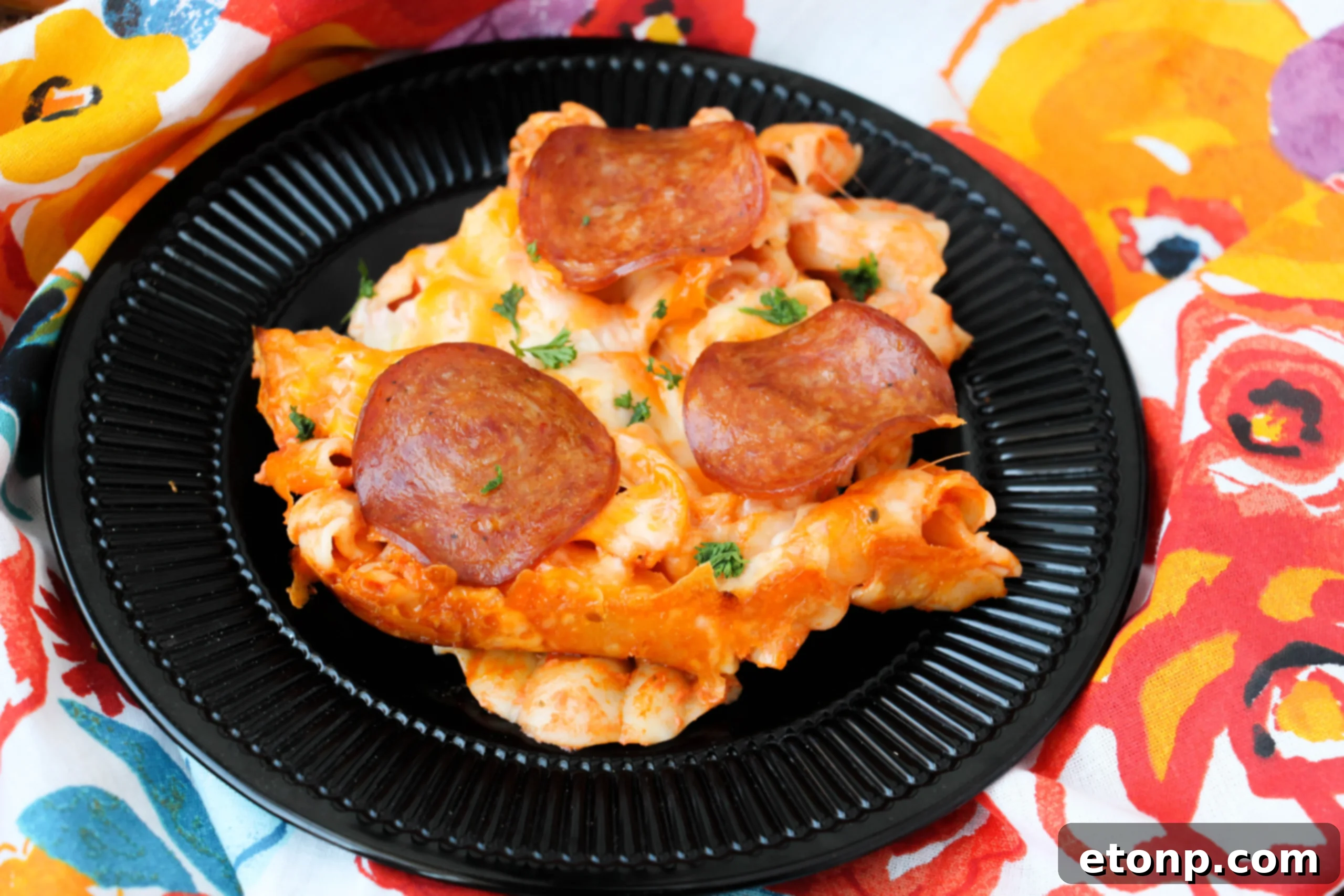 Baked pepperoni pizza pasta in a casserole dish, ready to serve.