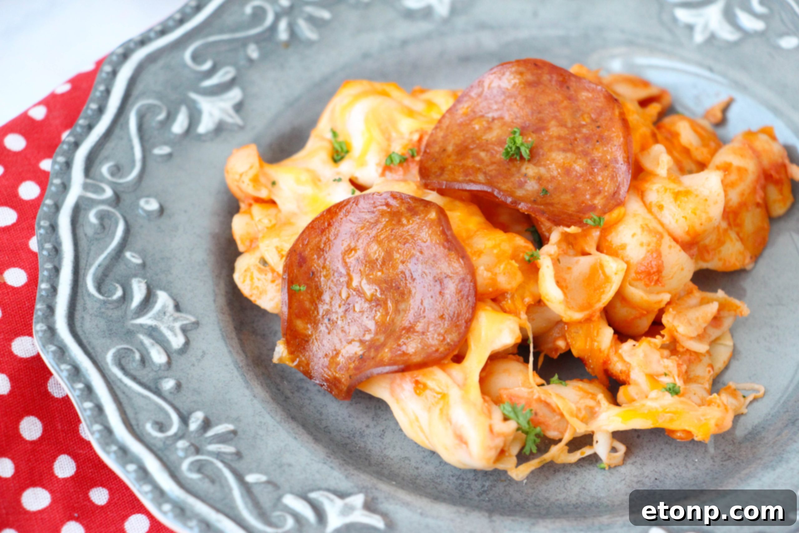 A large casserole dish of pepperoni pizza pasta bake, perfect for a crowd.