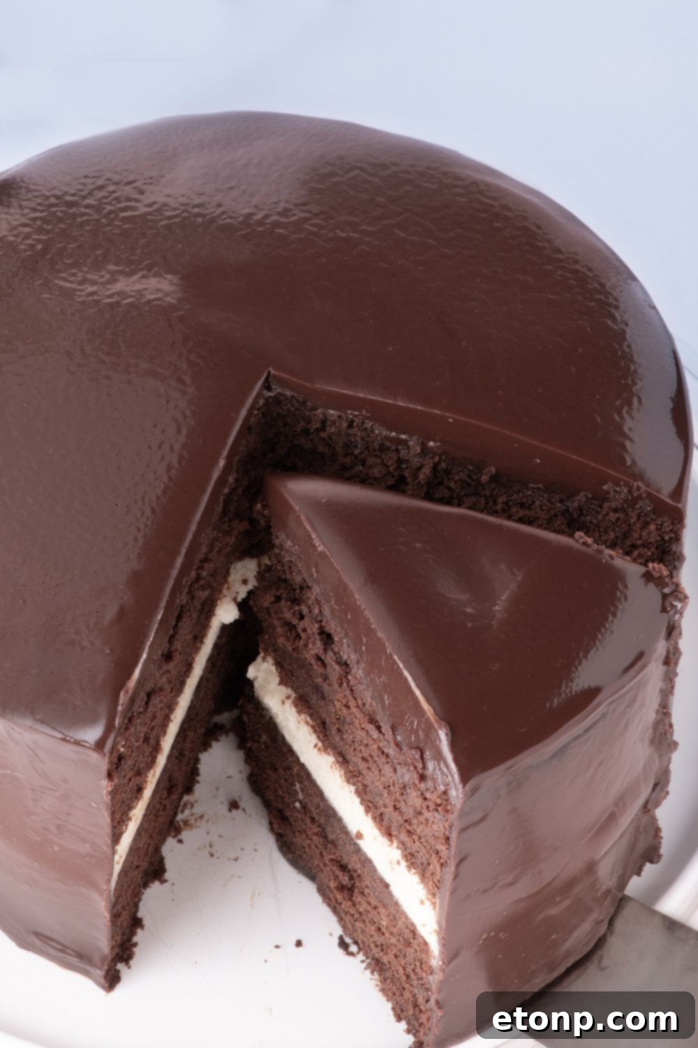 Ding Dong Cake with a slice being lifted up with a cake spatula