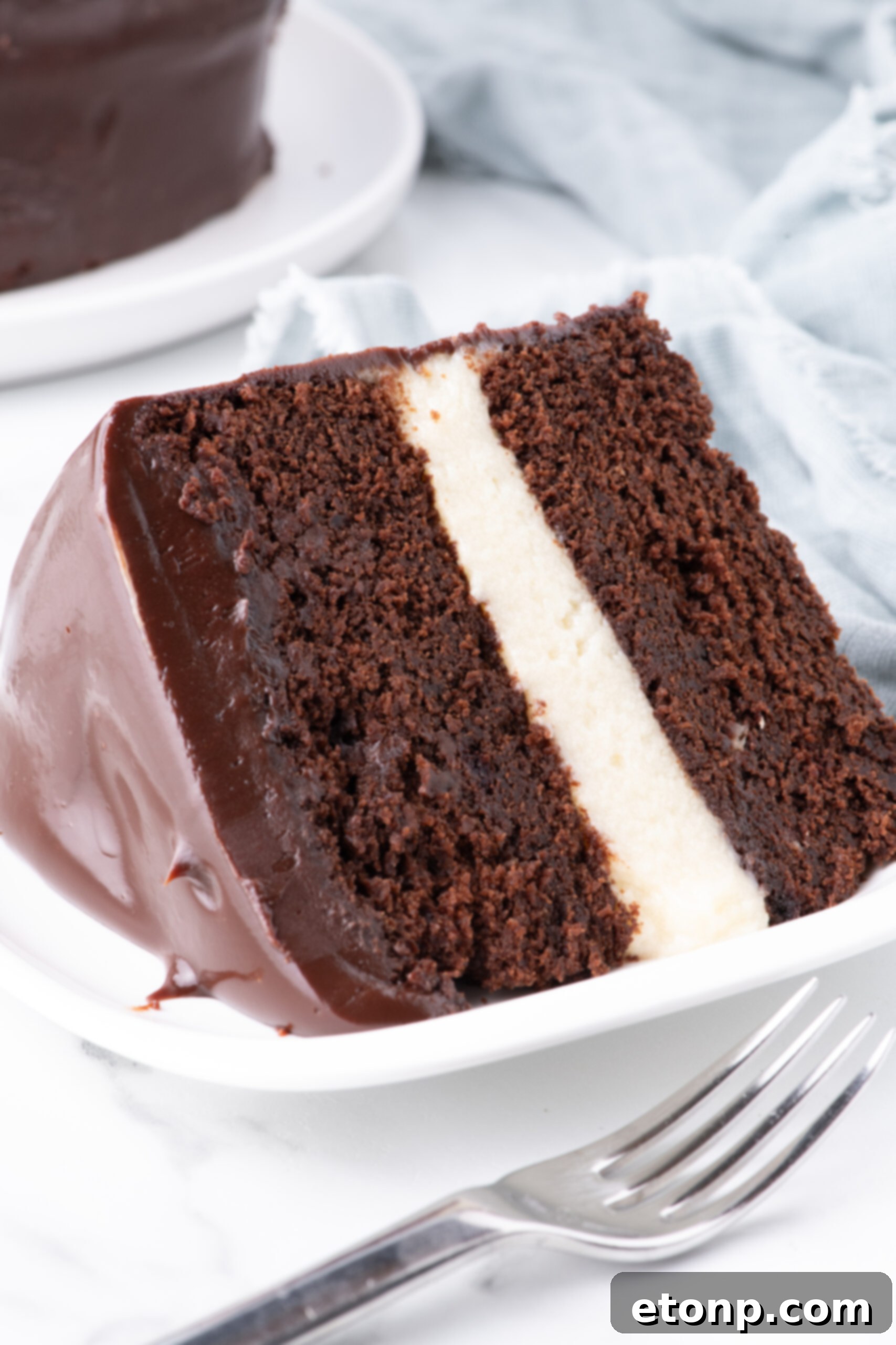 up close shot of Slice of Ding Dong Cake on a white plate showing the  center