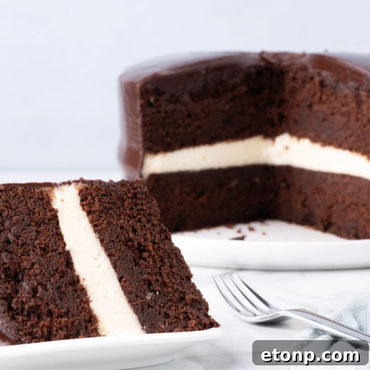Ding Dong Cake on table with a slice of cake on plate