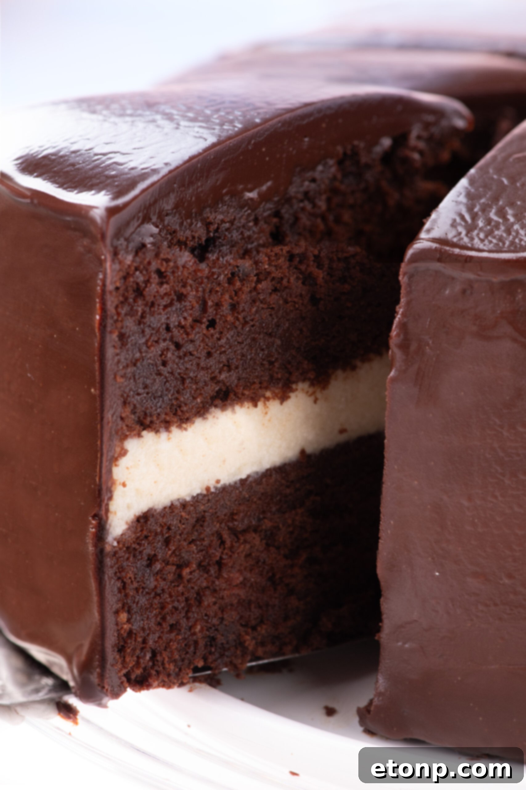Slice of Ding Dong Cake being removed from the cake 