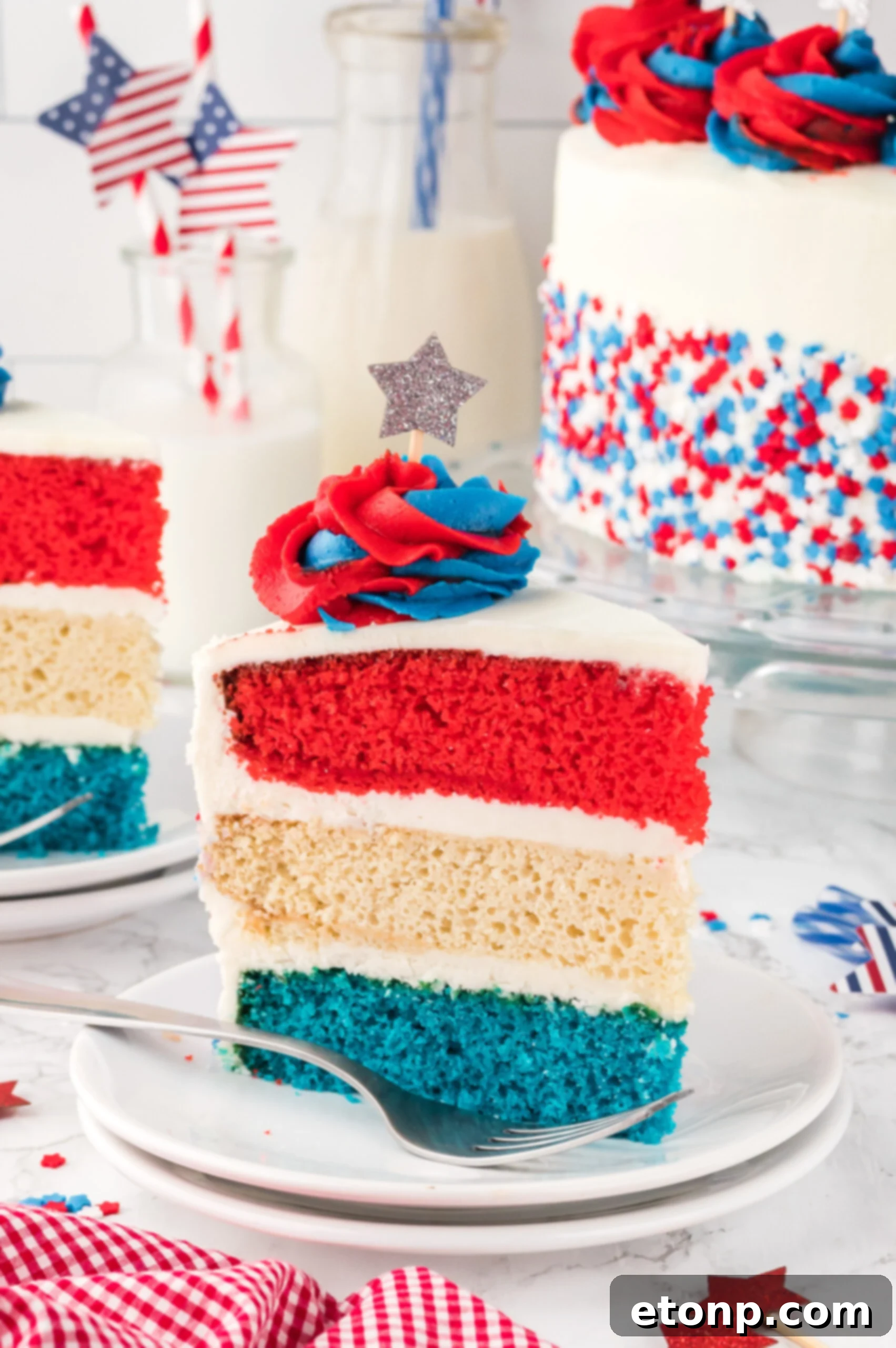 Slice of American Flag Layered Cake on a white plate 