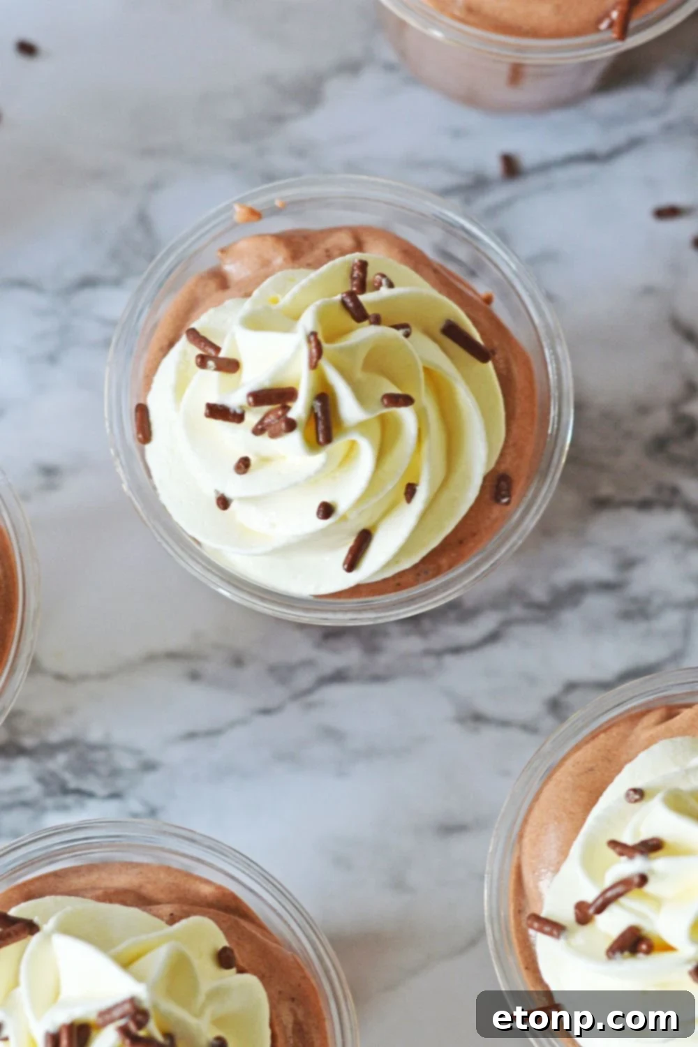 Decadent Chocolate RumChata Pudding Shots 12 overhead look of Rumchata Pudding Shots on a marble table