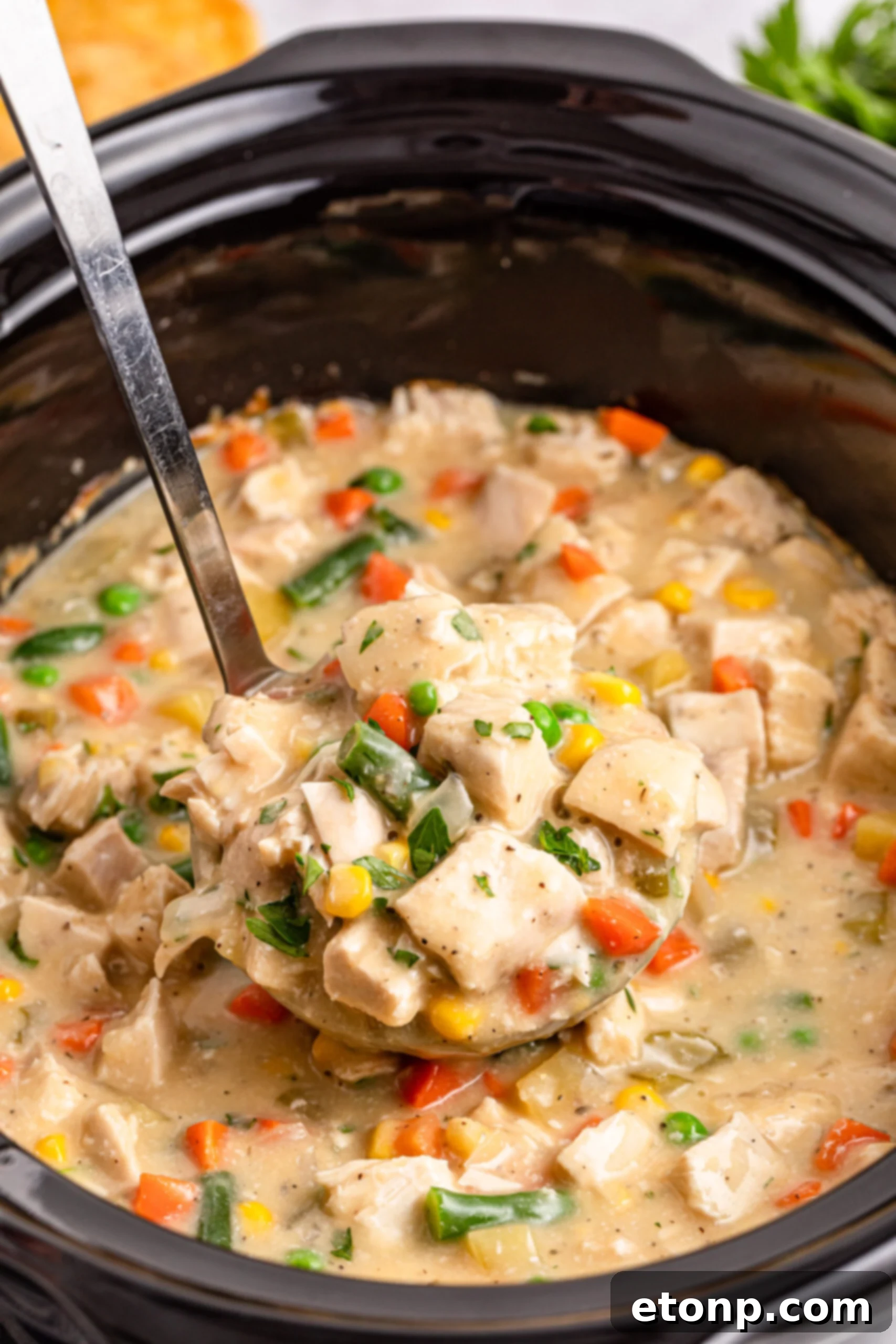 overhead shot of the Slow Cooker Chicken Pot Pie in a black crock pot 
