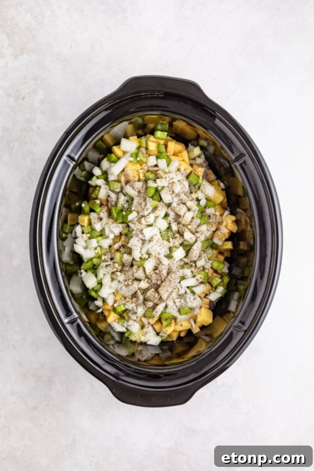 ingredients for pot pie in slow cooker on table 