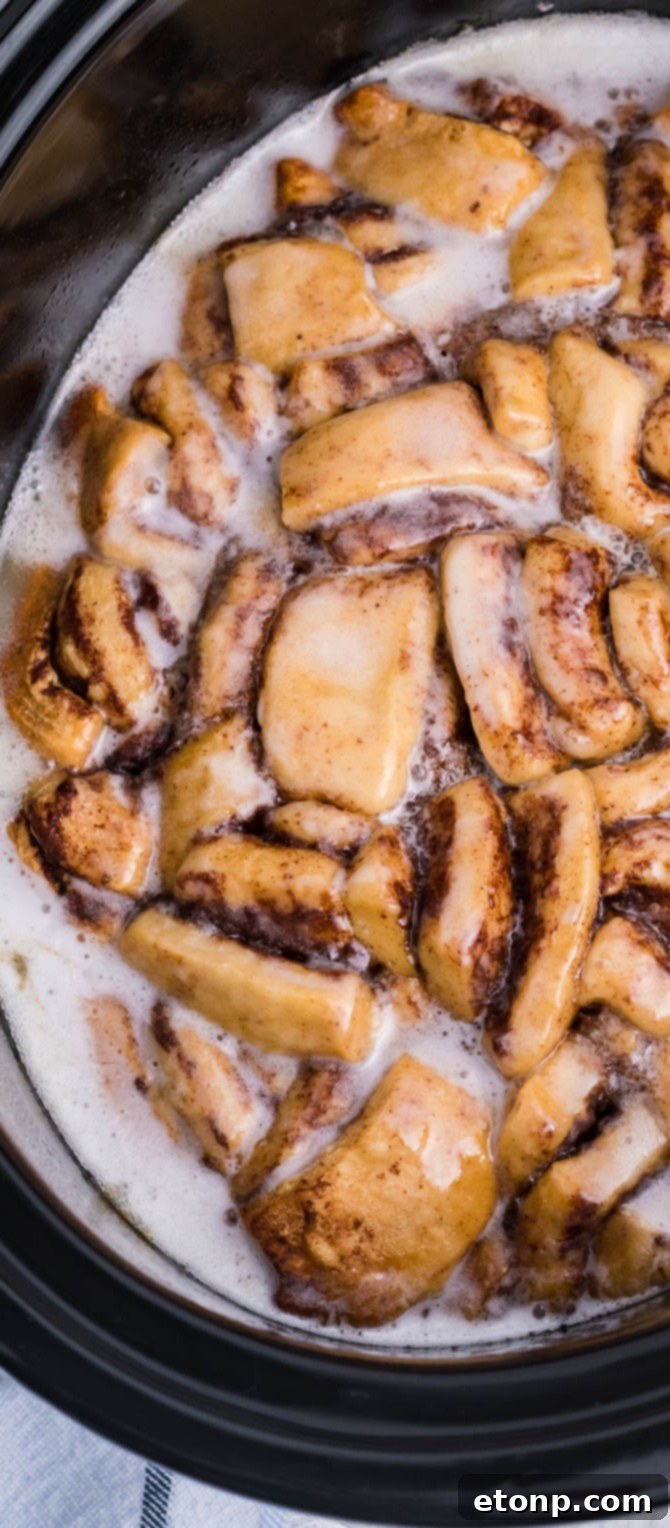 Cinnamon Roll Casserole up close covered in a generous layer of sweet cream cheese icing.