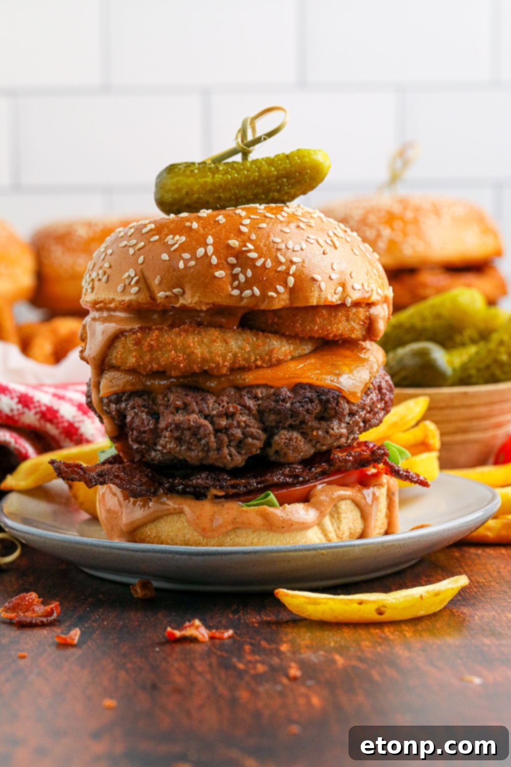 plates with Cowboy Burgers on each of them and a small fry in front of the plate 