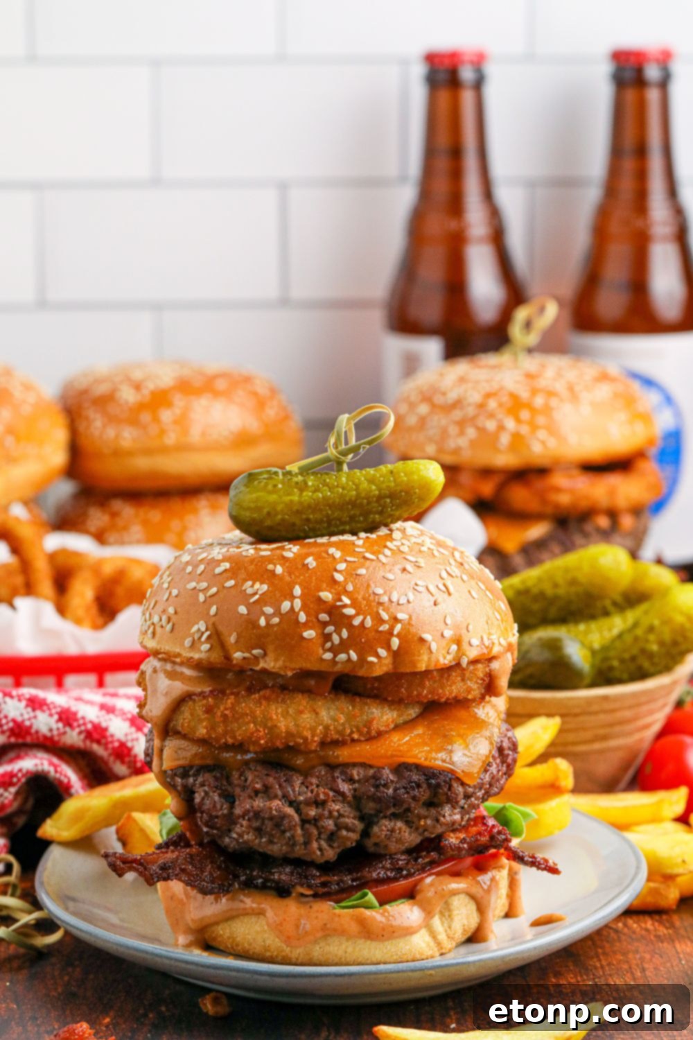 Cowboy burgers on table with beers in the background of image