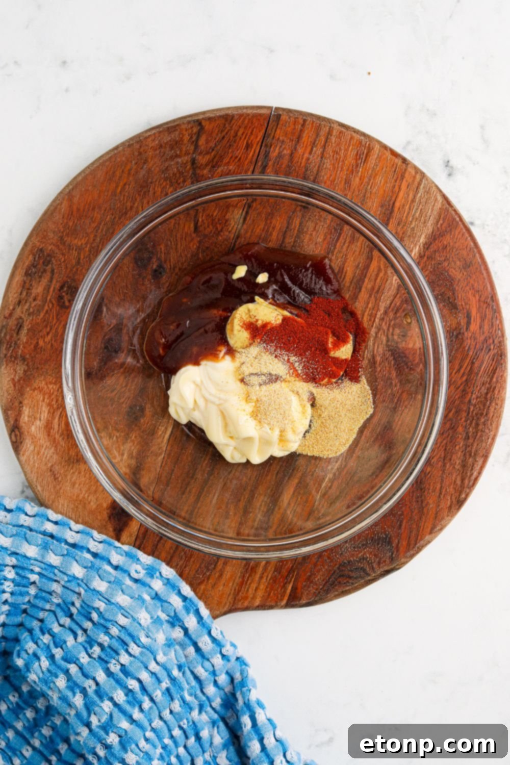 ingredients for Cowboy Burger sauce in a glass bowl on table 